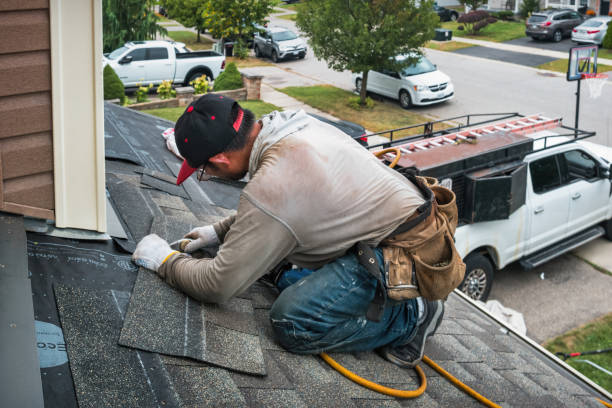 Professional Roofing technician working in Tewksbury, MA